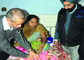 Doctors attending on the triplets born at the Jallianwala Bagh Memorial Hospital in Amritsar