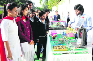 A student explains a model to visitors during an exhibition at the State Institute of Education in Sector 32, Chandigarh, on Tuesday. 