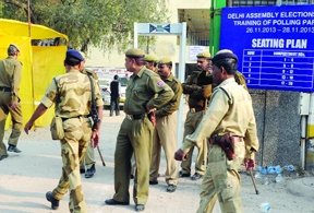 High security alert in a polling booth at N.P. Bengali Senior Secondary School, Gole Market in New Delhi on Tuesday.