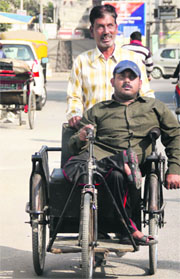 Dana Ram and his polio-afflicted cousin, Ravi,  in Jalandhar on Tuesday.