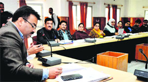 Additional District Commissioner Kalyan Singh Parihar holds a meeting to discuss anti-smoking measures in Jammu on Tuesday.