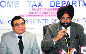 Chief Commissioner of Income Tax, Amritsar circle, Gurpreet Singh addresses a press conference in Srinagar on Tuesday. 