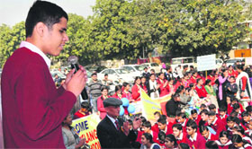 A child with special abilities interacts with the people at a market in Dugri, Phase I, Ludhiana.