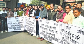 Members of the Action Against Corruption, an NGO, take out a rally in Ludhiana.