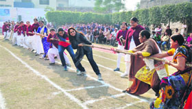 Students and staff of Adarsh Public School, Ludhiana, take part in a tug-of-war.