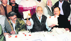 Vijay Bahadur Singh, Deputy Commissioner, Customs, with the seized contraband in Amritsar on Tuesday. Photo: Vishal Kumar
