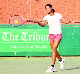Gayatri hits a forehand against Nikita in her second round match of The Tribune Championship at CLTA on Tuesday.