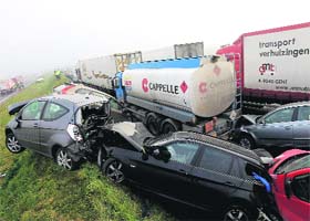 The haze effect: Crashed cars on a highway at Zonnebeke in Belgium on Tuesday