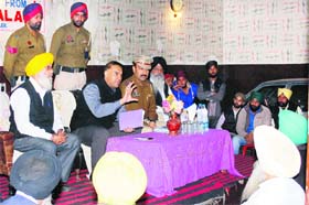 ADCP Parampal Singh (second from left) along with other police officials holds a meeting on beat-patrolling system with residents in Amritsar