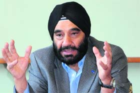Joginder Singh, president and MD, Ford India, addresses mediapersons in Amritsar on Wednesday