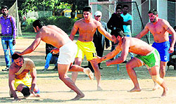Players of the SGGS-26 and GHG College, Gursar Sudhar, in action during the Punjab Style Circle Kabaddi Tournment in Chandigarh