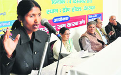 A woman from a disaster-affected area shares her experiences at a public hearing in Dehradun on Wednesday. Tribune photo: Abhyudaya Kotnala