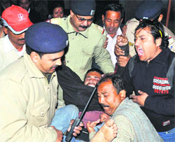 Policemen take away statehood agitators, who were on an indefinite fast in support of their demands to hospital 