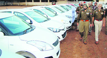 IG Patiala Zone Paramjit Singh Gill and HS Mann, SSP, inspect recovered cars with fake registration numbers from an inter-state gang of thieves in Patiala on Wednesday.