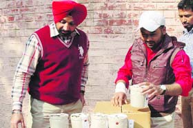 The District Health Officer, Dr Shivkaran Singh Kahlon, and his team collect samples during a raid in Amritsar