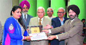 Dr Arpanpreet Kaur being felicitated at Guru Angad Dev Veterinary and Animal Sciences University in Ludhiana on Thursday.