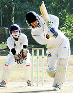 A batsman plays a shot in a match in the Youth Cup Cricket Tournament at the Rangers College ground in Dehradun on Thursday