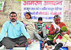 Members of a rape victims family on an indefinite fast in Gurgaon on Thursday, seeking immediate arrest of the accused