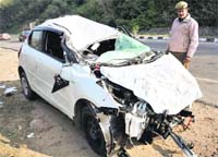 The mangled remains of the Swift car which met with an accident in Jammu on Thursday. Tribune photo: Inderjit Singh