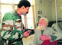 100-year-old ex-serviceman and World War I and II veteran, Havildar (retd) Mohi-ud-din, at the Military Hospital in Jammu on Thursday. A Tribune photograph 