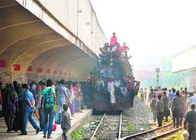 Commuters travel on a train during an ongoing blockade organised by the Bangladeshi Nationalist Party in Dhaka on Thursday