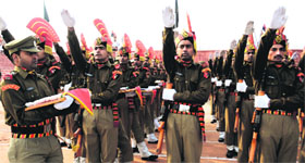 Newly recruited jawans of the Border Security Force take oath during a passing-out parade at the forces training centre at Humhama near Srinagar on Friday.