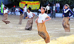 Girls take part in a sack race during the annual athletics meet at the SDP College for Women ground, Ludhiana, on Friday