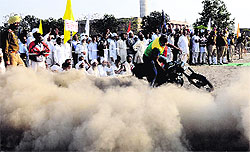 A Punjab Police personnel performs a stunt on the concluding day of the Punjab Prison Games at the Central Jail in Ludhiana on Friday