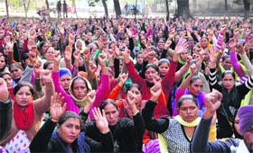 ASHA workers and facilitators hold a protest rally in favour of their demands in Amritsar on Saturday