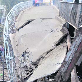 The damaged pedestrian way on Bhandari bridge in Amritsar