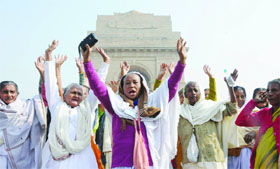 Windows from Vrindavan at India Gate during their visit to Delhi on Saturday. The Sulabh International Social Service Organisation, an NGO, has been taking care of them after a Supreme Court order.