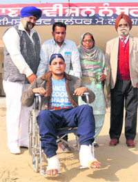 Mandeep Singh, who had attempted suicide and was injured in Malaysia while trying to escape confinement, at a police station in Jalandhar on Saturday.