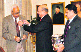 Armed forces token flag being pinned onto the coat of Governor NN Vohra at the Raj Bhawan in Jammu on Saturday.