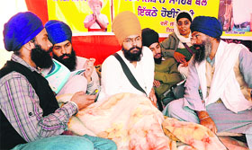 Damandeep Singh (yellow turban) on hunger strike in Mohali on Saturday.