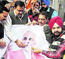 BJP activists celebrate the victory of their party in Amritsar on Sunday