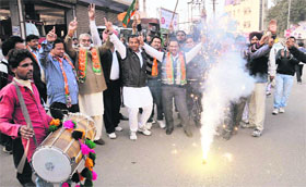 Activists in Bathinda celebrate the victory of the BJP in four states on Sunday.