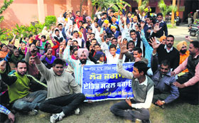 Members of the Un-aided Staff (Aided Schools) Front stage a dharna in support of their demands in Bathinda on Sunday.