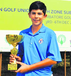 Golfer Aadil Bedi with the winners trophy of the All-India Junior Golf Competition