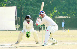 A batsman plays a shot in a match in the Youth Cup Cricket Tournament played at Rangers College ground in Dehradun on Saturday.