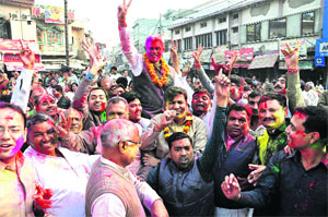BJP workers celebrate victory in Rohtak on Sunday. 