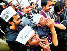 Aam Aadmi Party supporters celebrate the partys excellent show in New Delhi on Sunday