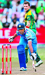 Rohit Sharma makes a desperate attempt to make his ground as Dale Steyn looks on during the second ODI in Durban on Sunday