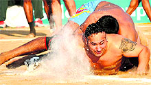 A Canadian raider scores a point against Pakistan in Roopnagar on Sunday