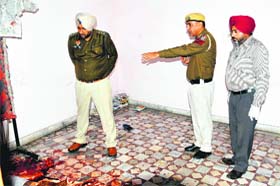Police examine the spot where 22-year-old Bunty was found murdered in Mata Jeevi Nagar area on Monday
