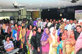 A Long wait: A huge rush was witnessed at the Suwidha Centre located in the District Administrative Complex where people lined up to get forms for the below poverty line (BPL) cards being issued to avail of the new Atta-Dal scheme
