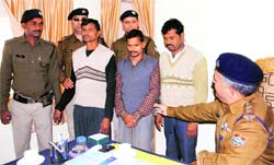Three theives, who had stolen BSNL cables over three months ago, in police custody in Dehradun on Monday. A Tribune photograph