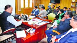 Amit Sinha, DIG, Garhwal range, discusses security arrangements in Dehradun on Monday for Narendra Modis rally on December 15. A Tribune photograph