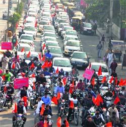 Activists and supporters of the Akhil Bharatiya Punjabi Jagriti Manch march in a vehicular procession during a road show in Rohtak. A Tribune photograph