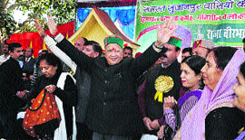 Chief Minister Virbhadra Singh waves at a crowd at a public meeting in Toani Devi on Monday.