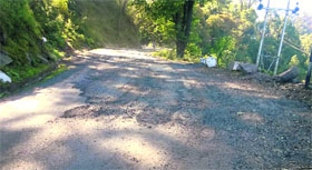 Worn off stretch on the Dharampur-Sanawar road at Bandkhor, which was repaired a few months ago.